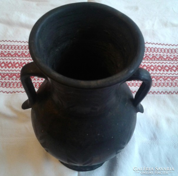 Old black ceramic vase