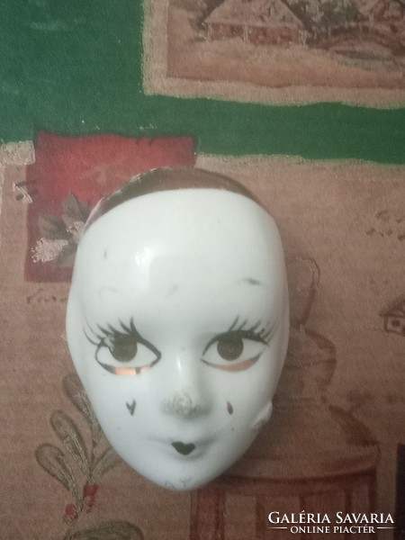 Porcelain pierrot head badge from the 1980s