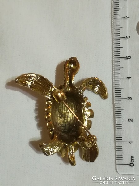 Turtle brooch.