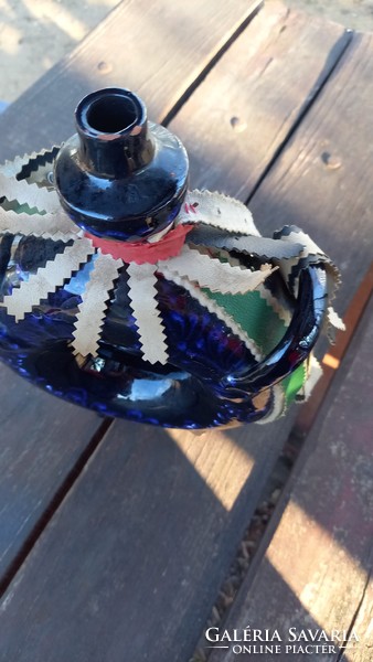 Blue glazed ceramic pretzel bottle