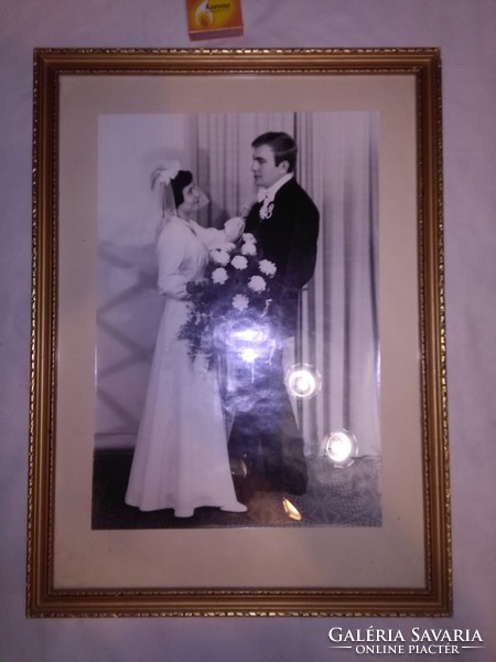 Retro gilded photo frame with wedding photo
