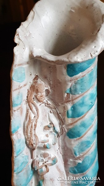 Old, retro, stylized female figure in a glazed ceramic vase. 18 cm High.