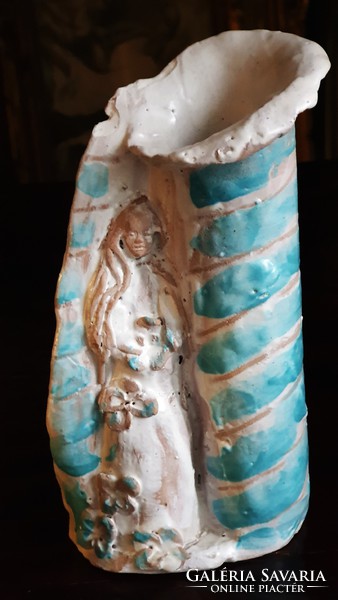 Old, retro, stylized female figure in a glazed ceramic vase. 18 cm High.