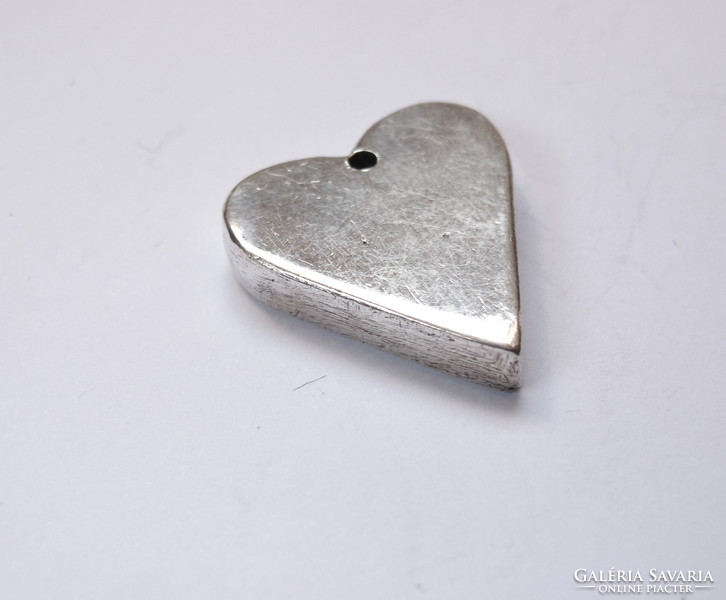 Handmade solid silver pendant.