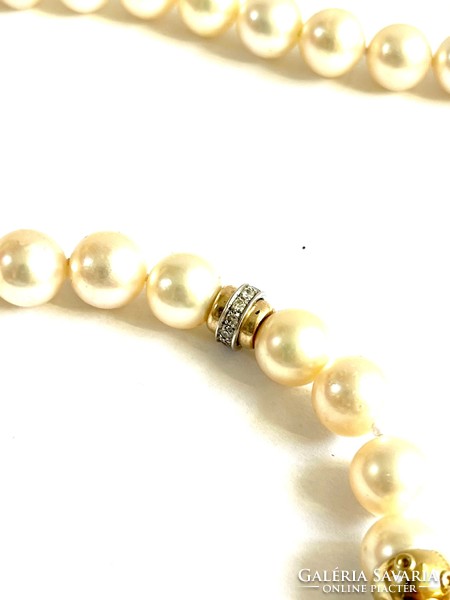 Exciting true pearl with 18k gold and over 1ct diamonds! It is embellished