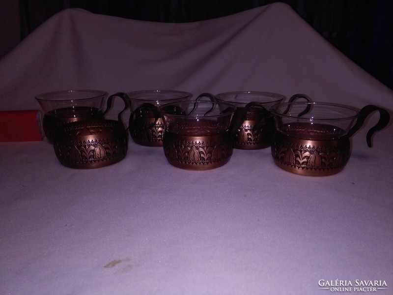 Artistically worked brass cups and Jena glasses - tea
