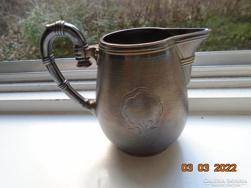 19.So christofle guilloche silver-plated patinated numbered cream spout with baluster pliers