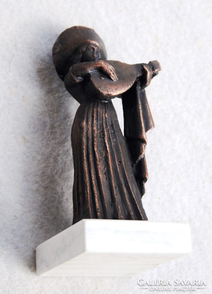Woman in lanton playing in medieval attire - bronze statue on marble pedestal