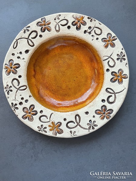 Handcrafted ceramic plate with amber glaze