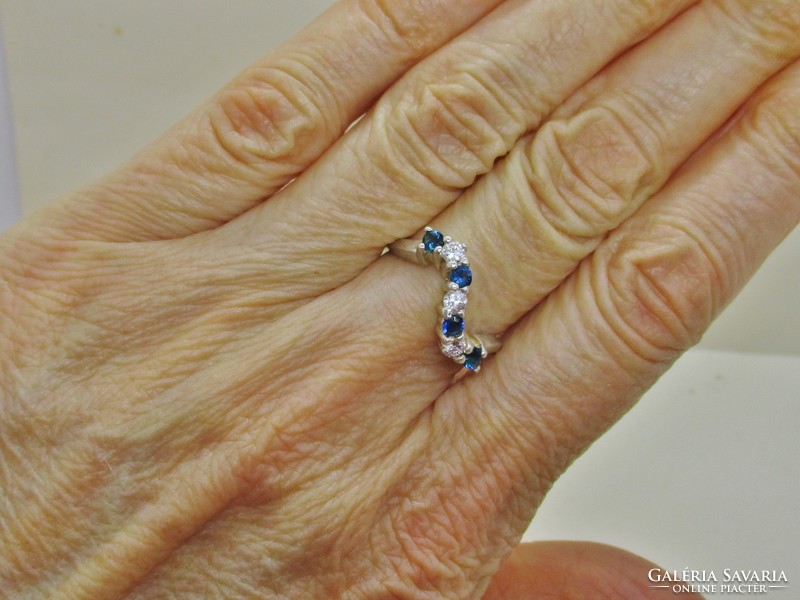 Beautiful wavy silver ring with blue and white stones
