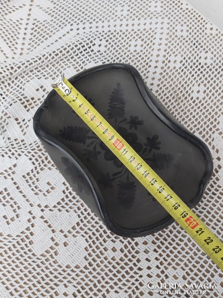 Beautiful reeds in black ceramic ashtray holding nostalgia for collector village peasant