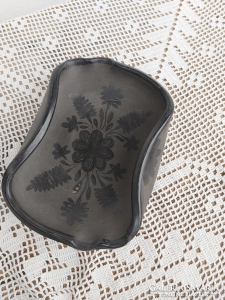 Beautiful reeds in black ceramic ashtray holding nostalgia for collector village peasant