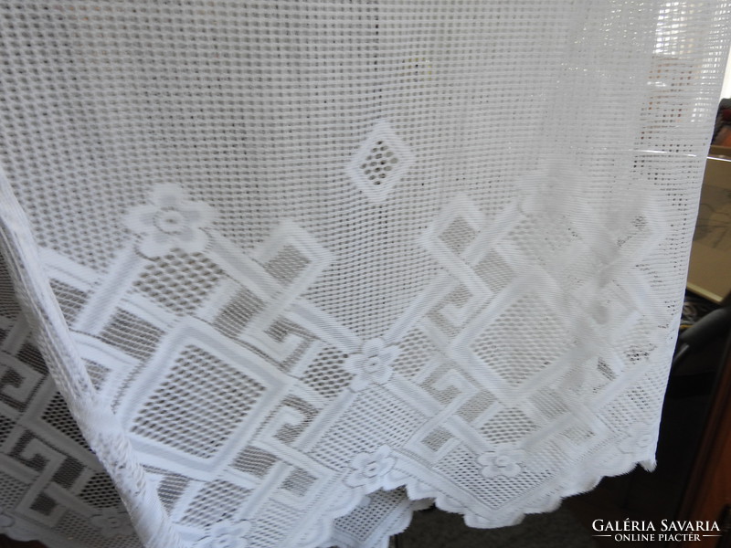Eclipse lace curtain with geometric patterns