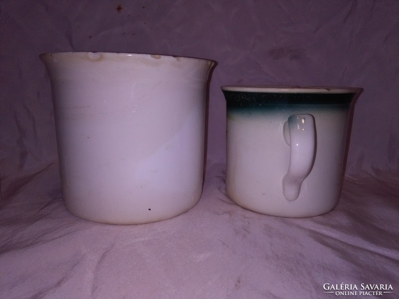 Two old granite mugs with sleeping milk - together