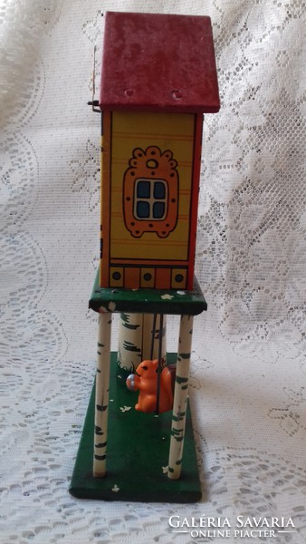 Antique tin cottage shaped toy clock