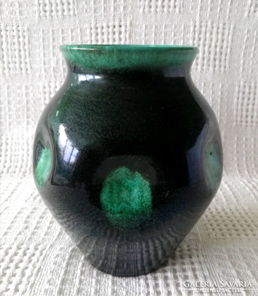A ceramic vase of a galvanized craftsman