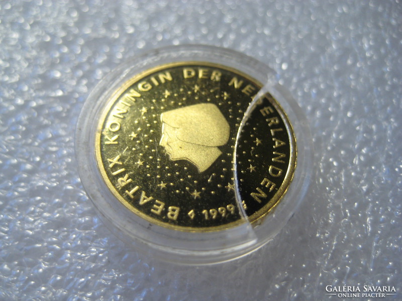 Dutch euro gilded 10 cents with profile of Queen Beatrix. Collectible piece in 20 mm capsules