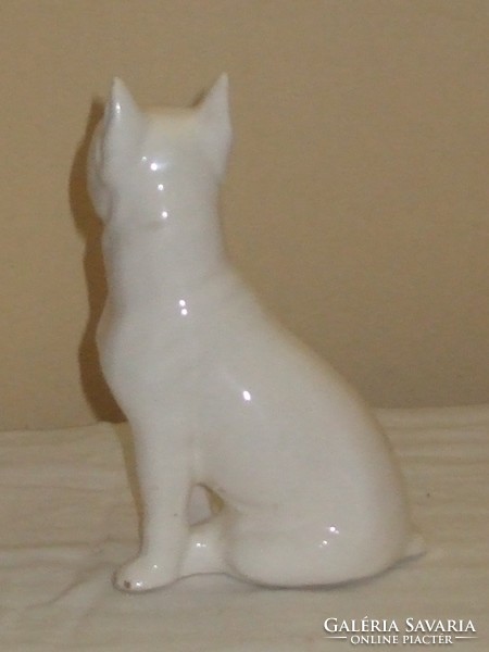 White boxer dog statue.
