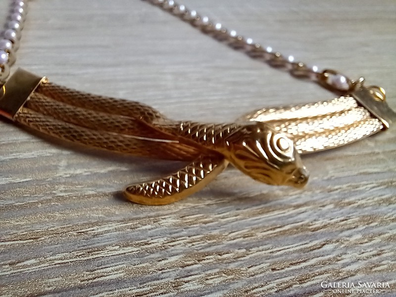 Gold-colored snake necklace