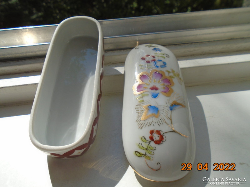 Antique hand painted oval porcelain box with gold contoured floral patterns
