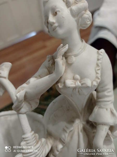Very beautiful white biscuit figure with woman basket