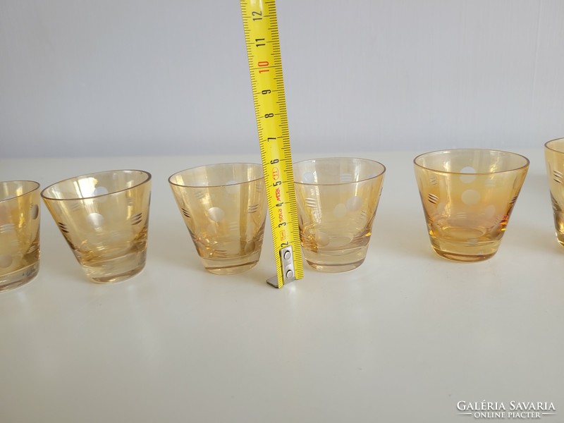 Retro old gold colored polka dot drink set with glass holder for mid century