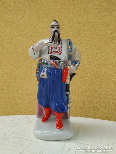 Porcelain sculpture, ornament, pipe man dressed in folk costume for sale!