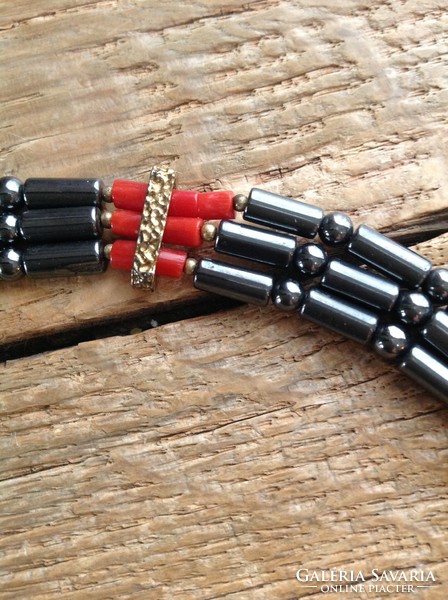 Hematite necklace decorated with noble coral with gold-plated silver ornaments and fittings