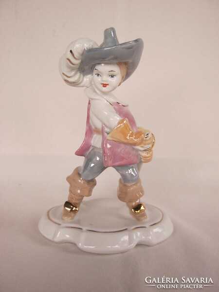 Porcelain boy in musketeer costume