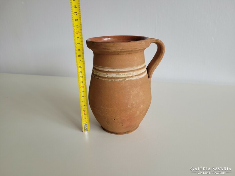 Old vintage striped folk earthenware milk jug glazed pot with handle jug earthenware jug