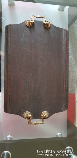 Old wooden tray with copper handle.