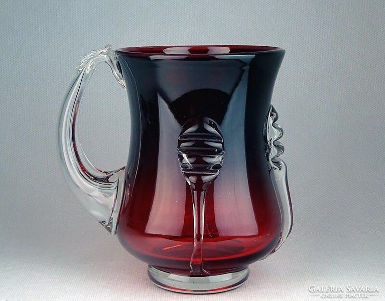 Beautiful jug made of burgundy blown glass