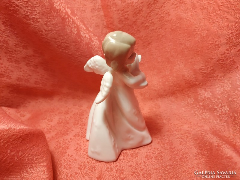 Charming porcelain musical angel
