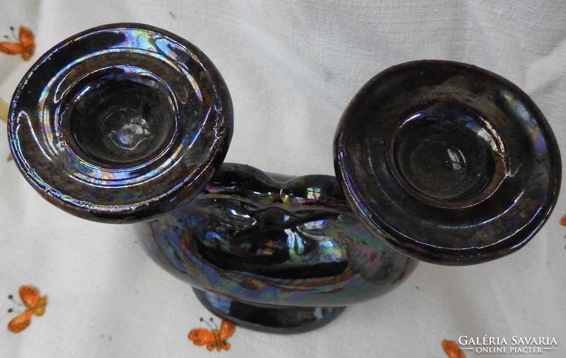 Eosin glazed two-pronged ceramic candlestick with heart decor in the middle