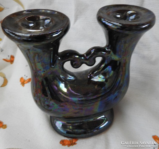 Eosin glazed two-pronged ceramic candlestick with heart decor in the middle