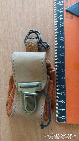 Cute little leather purse on lake
