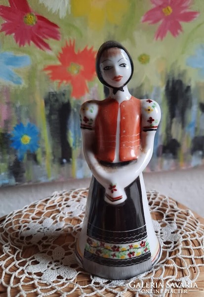 Girl figurine in matyo dress with raven house