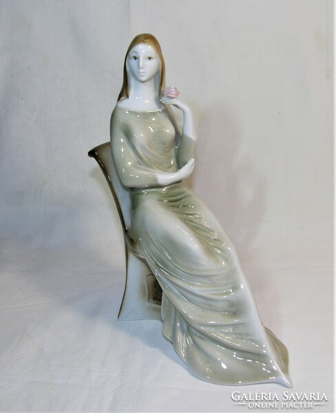 Sitting woman with flowers - old zsolnay porcelain figurine