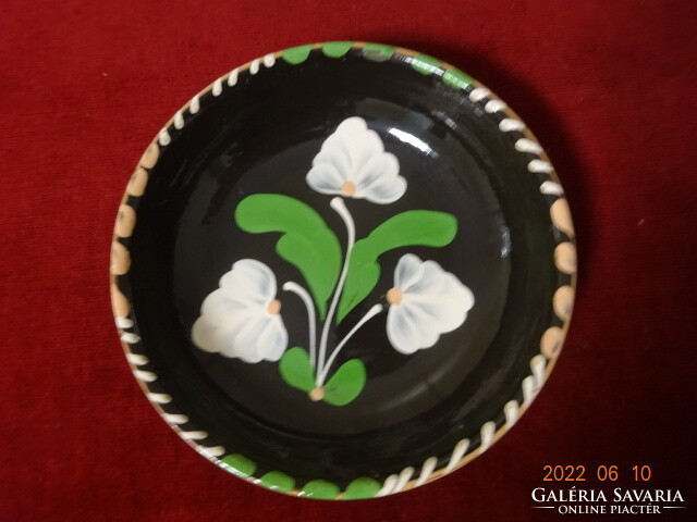Glazed ceramic hand-painted wall plate. White flower on a black background. He has! Jókai.