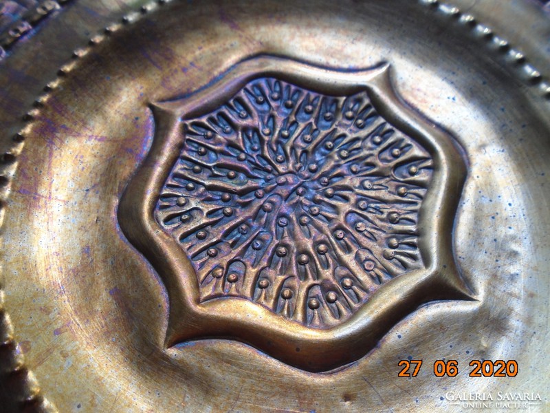 Signed modern artistic trembling, punched copper wall plate inspired by ancient patterns