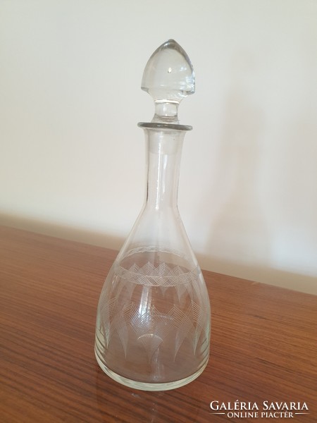Old corked drinking glass vintage liquor bottle with polished pattern