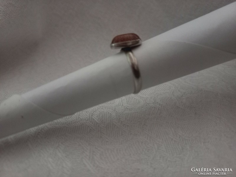 Silver ring with a brown stone