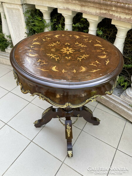 Beautifully shaped round table decorated with copper