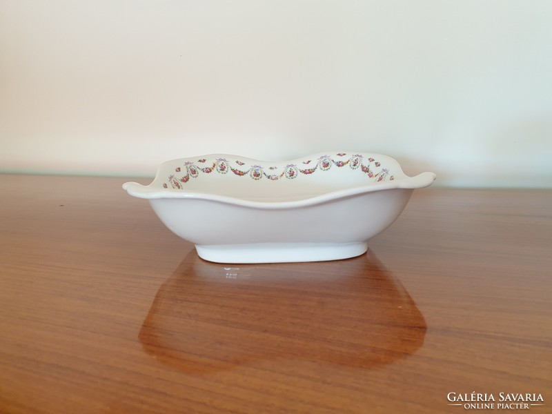 Old square rose-patterned porcelain bowl with flower garland and rose garnish