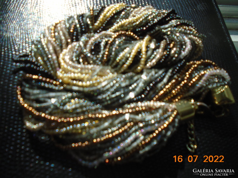 Spectacular necklaces strung with 30 rows of tiny multi-colored pearls with a gold-plated clasp