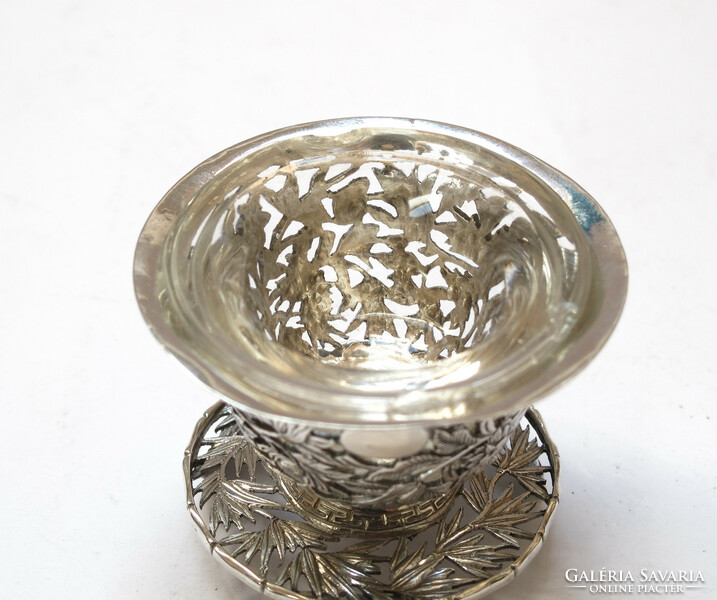 Ornate oriental silver spice holder.