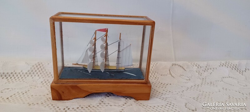 Small ship model in a glass cage