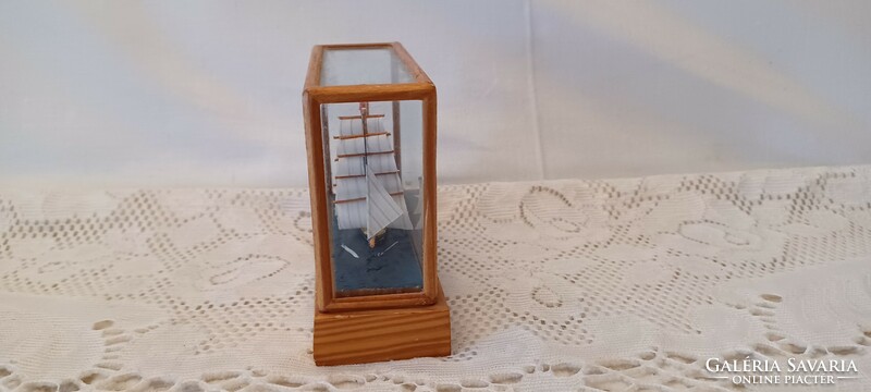 Small ship model in a glass cage