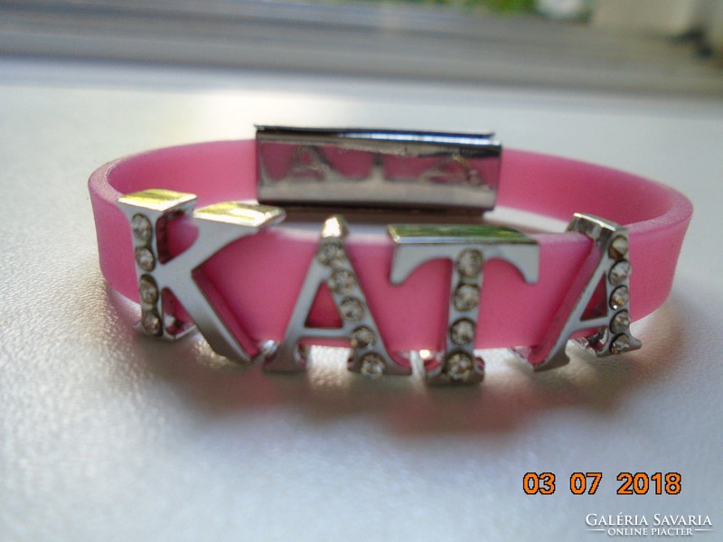 Modern pink wrist strap kata decorated with silver-plated, stone-encrusted letters