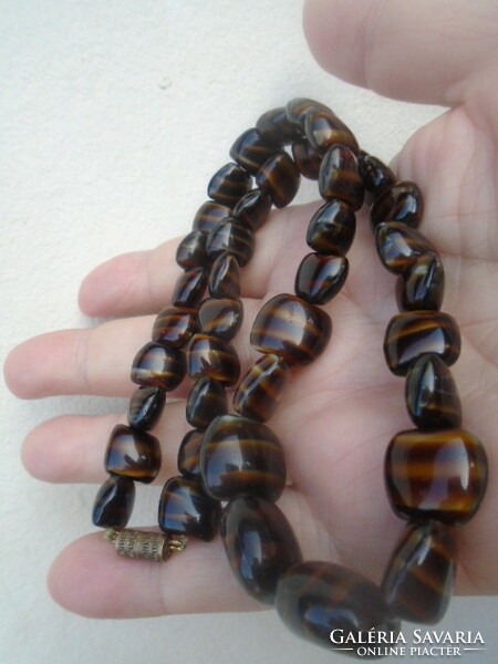 A tiger eye chain in one of the rarest colors available is a serious weight